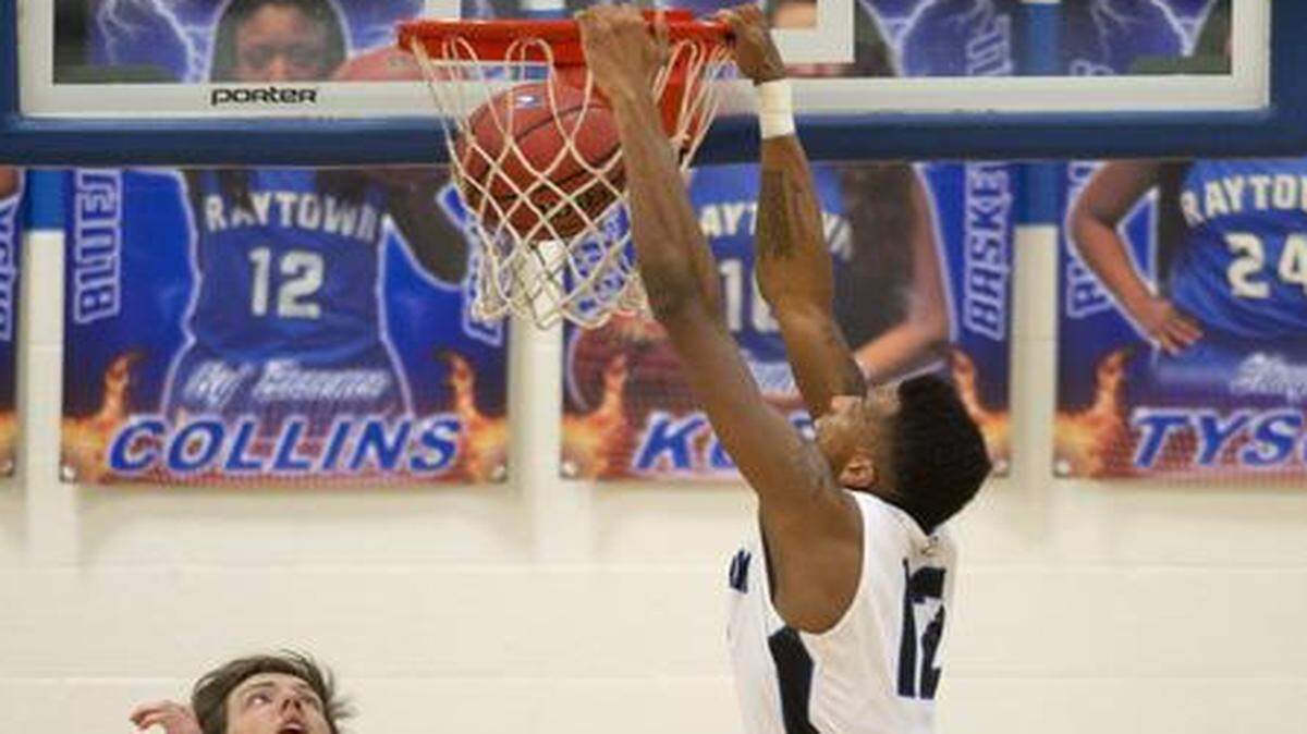 
Jailen Gill of Raytown High School slammed a dunk against Liberty North on Feb. 6, 2015.
