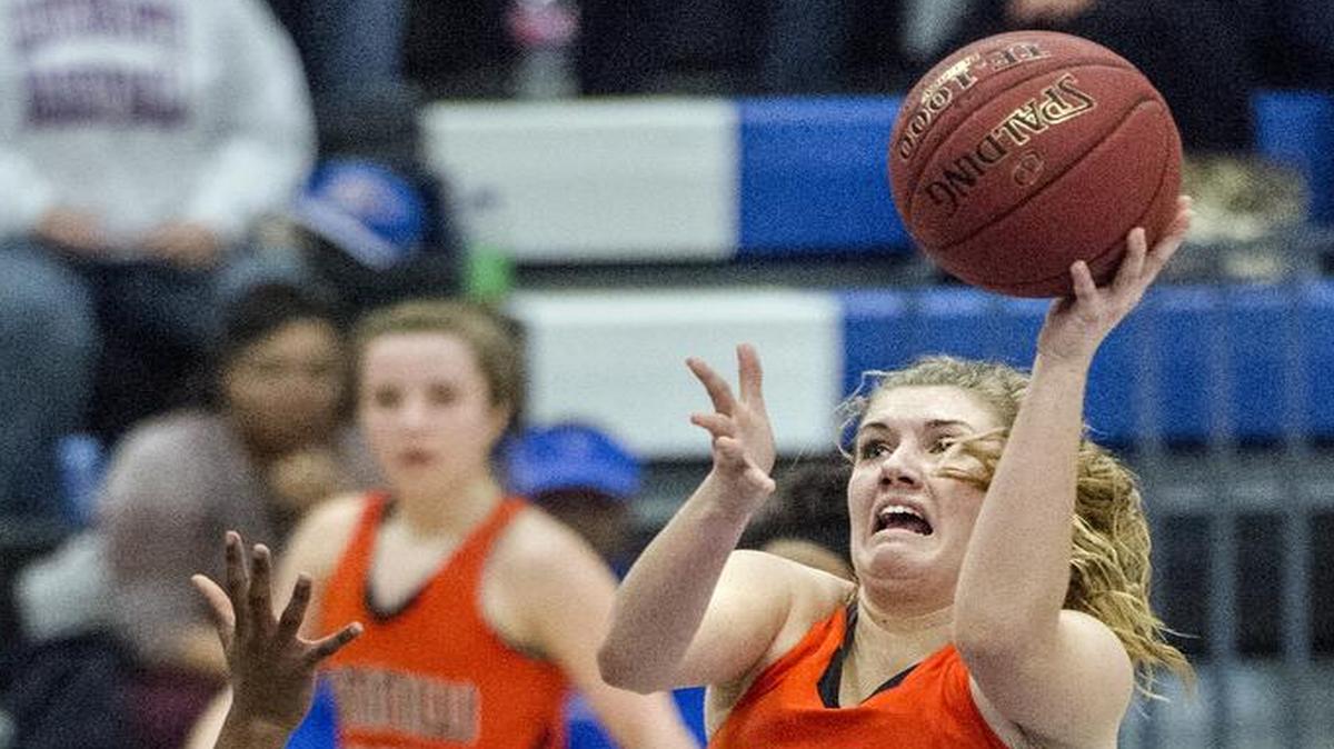 SM Northwest’s Brenni Rose went up for a shot against Leavenworth in a game earlier this season. She is all-time leading scorer in the Cougars’ girls basketball program.