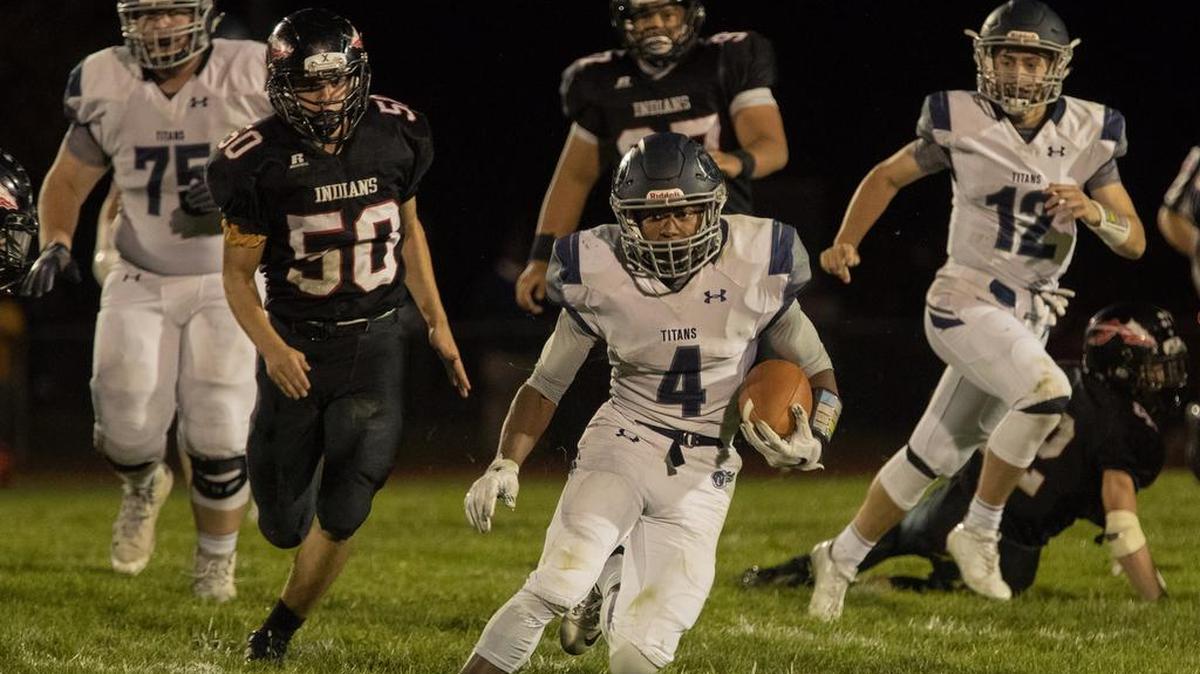 Lee’s Summit West running back Phillip Brooks (center) rushed for 143 yards and three touchdowns and also threw a TD pass in Friday night’s victory over Fort Osage.