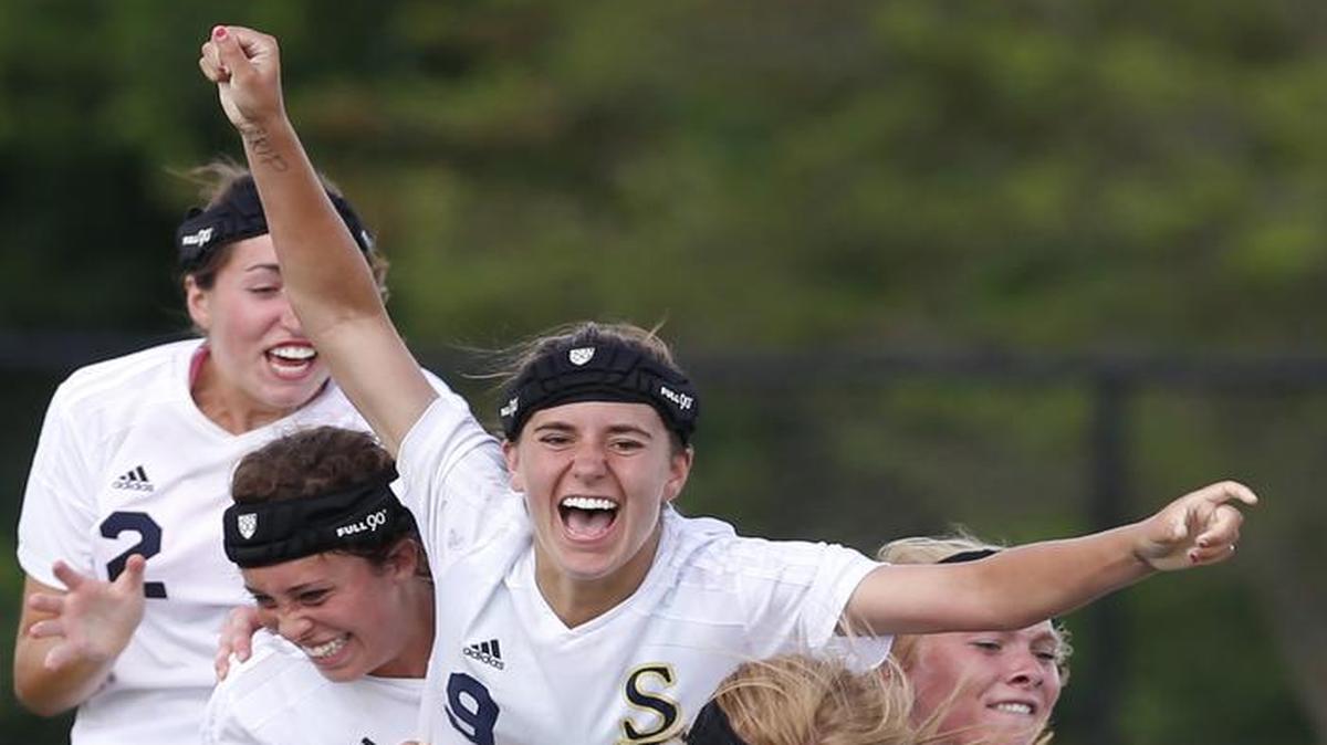 
Jamie Kutey (center), The Star’s All-Metro girls soccer player of the year, was swarmed by her St. Thomas Aquinas teammates after Kutey scored the winning goal in the 2014 Kansas Class 5A state championship match.
