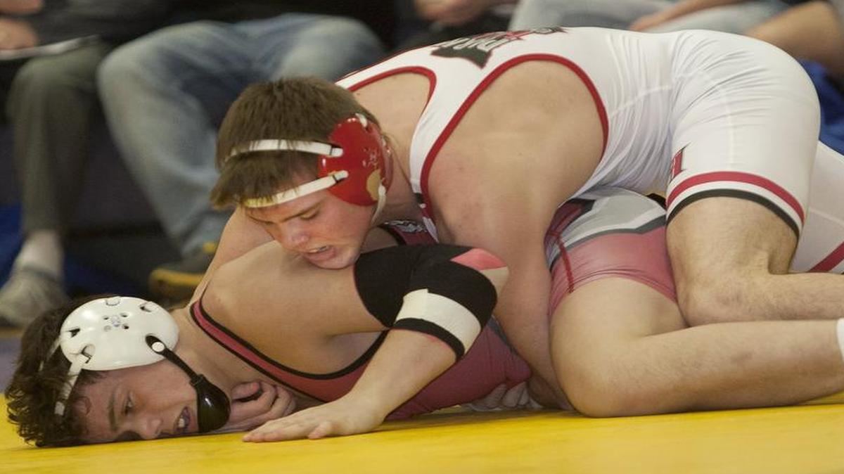 Canten Marriott of Park Hill (top) was one of seven Trojan wrestlers who won championships in the talent-rich field at the Elite 8 dual championships at Battle High School in Columbia.