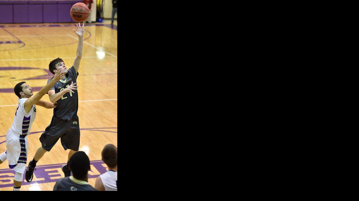 
Nick Janssen (right) finished with 18 points for Raymore-Peculiar in a 54-48 victory over Park Hill South on Friday night in the championship game of the North Kansas City Invitational.


