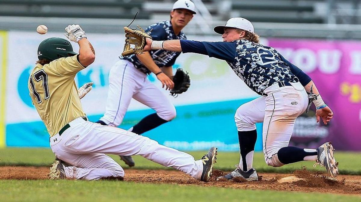 Lee’s Summit West senior Ethan Owens waits for the baseball during a pickoff attempt of Lindbergh’ Jon Halsted during the Missouri Class 5 baseball state tournament third-place game on Friday at CarShield Field in O’Fallon, Mo.