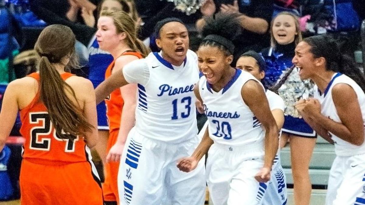 Leavenworth’s Aarika Lister (20) celebrated with her teammates after scoring and heading to the line in Friday’s game against Shawnee Mission Northwest at Leavenworth High School. Leavenworth won 52-47 in overtime.