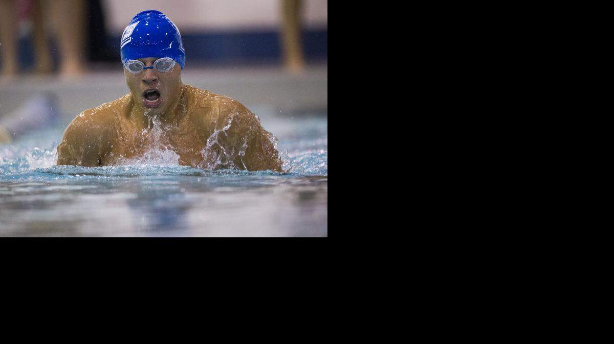 
Alex Dowling of Liberty gets a breath during the 100-yard breaststroke at the Independence Invitational on Saturday at the Henley Aquatic Center.

