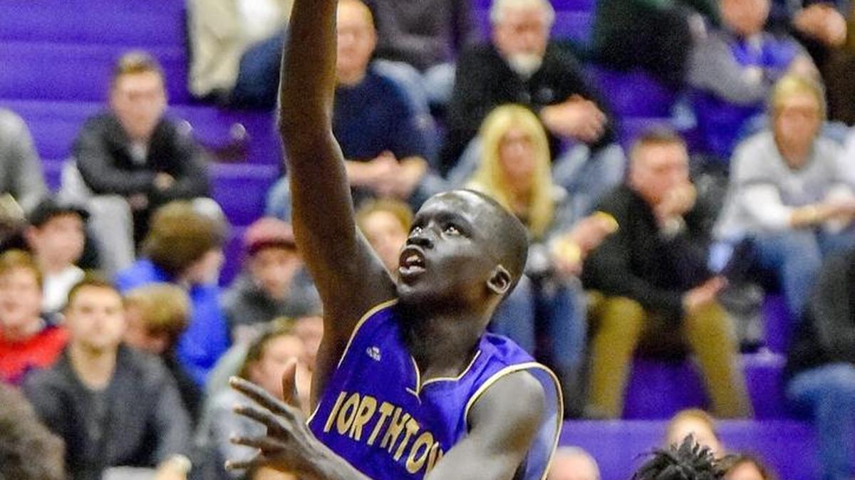 North Kansas City guard Deng Bol aims for the basket ahead of Park Hill South guard Lamel Robinson on Thursday during the Missouri Class 5 District 14 semifinal at Park Hill South. North Kansas City defeated Park Hill South 51-39 and went on to win the district championship.