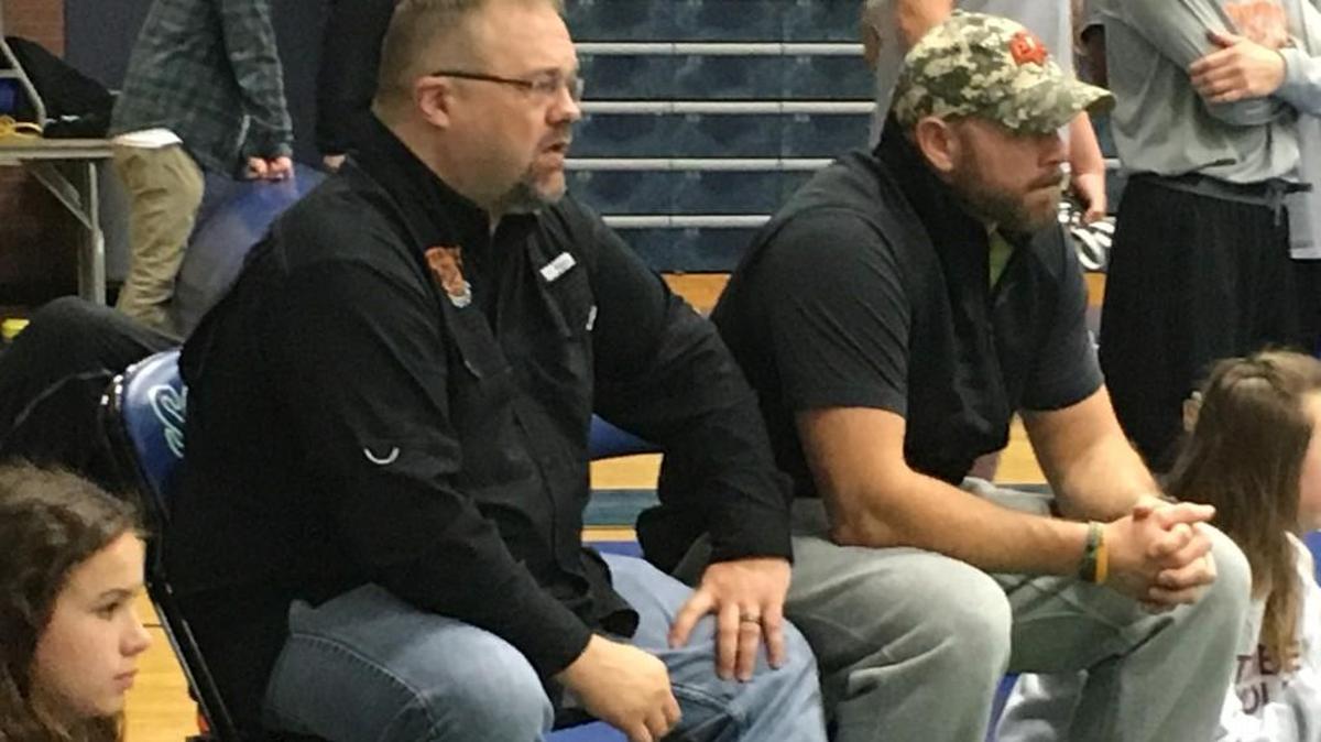 Platte County wrestling coach Reggie Burress (left) watches from the corner as the Pirates’ Casey Jumps competes in the 220-pound weight class final Saturday in the Lydia’s Lights tournament at Blue Springs South. Burress led the Pirates to the Class 3 state title last season.