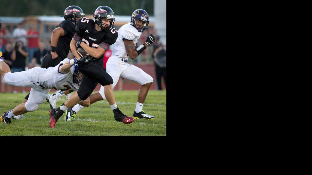 
Fort Osage running back Jesse McBee raced ahead of Dylan Cowling (left) of Blue Springs in the first quarter of Friday night’s game.
