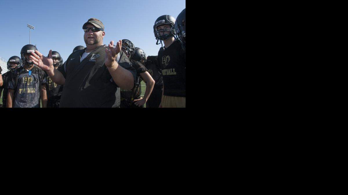 
Blue Valley head football coach Eric Driskell talked to his players during practice. Aug. 18 was the first day that high school football teams in Kansas could practice.
