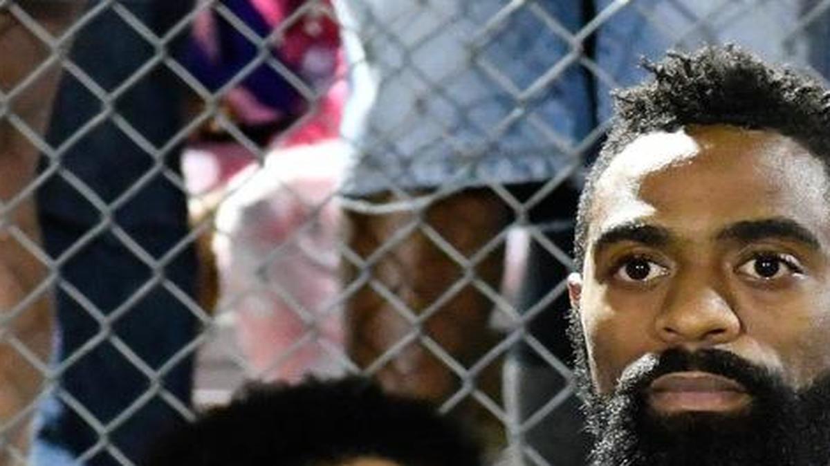 Former Olympian Tyson Gay speaks to the mourners gathered in memory of his daughter Trinity at Lafayette High School, Monday, Oct. 17, 2016, in Lexington, Ky. Several thousand people, including Tyson Gay, turned out Monday night for a candlelight vigil in Kentucky to honor Gay's 15-year-old daughter, who was fatally shot over the weekend.