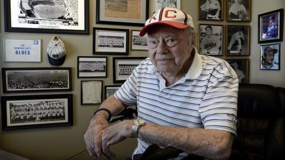 
The walls of one room in Sam Gould’s apartment at Village Shalom are covered with photos of players and newspaper front pages chronicling Kansas City’s baseball history.
