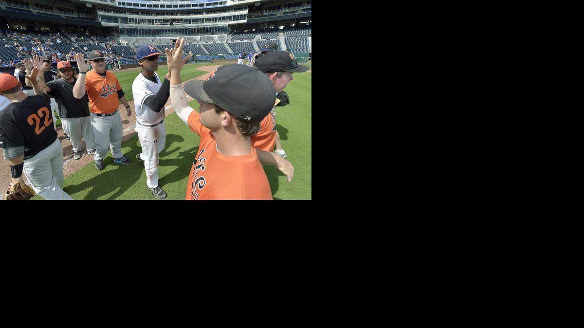 
The teams congratulate each other after the J All-Stars and B All-Stars, including Milgram Mustangs MVP Aaron Stubblefield (center), played during Sunday's Ban Johnson All Star baseball game on July 27, 2014, at Kauffman Stadium in Kansas City, Mo.
