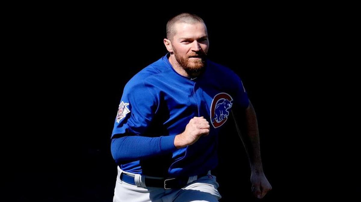 Chicago Cubs' Wade Davis runs drills during a spring training baseball practice, Friday, Feb. 24, 2017, in Mesa, Ariz.
