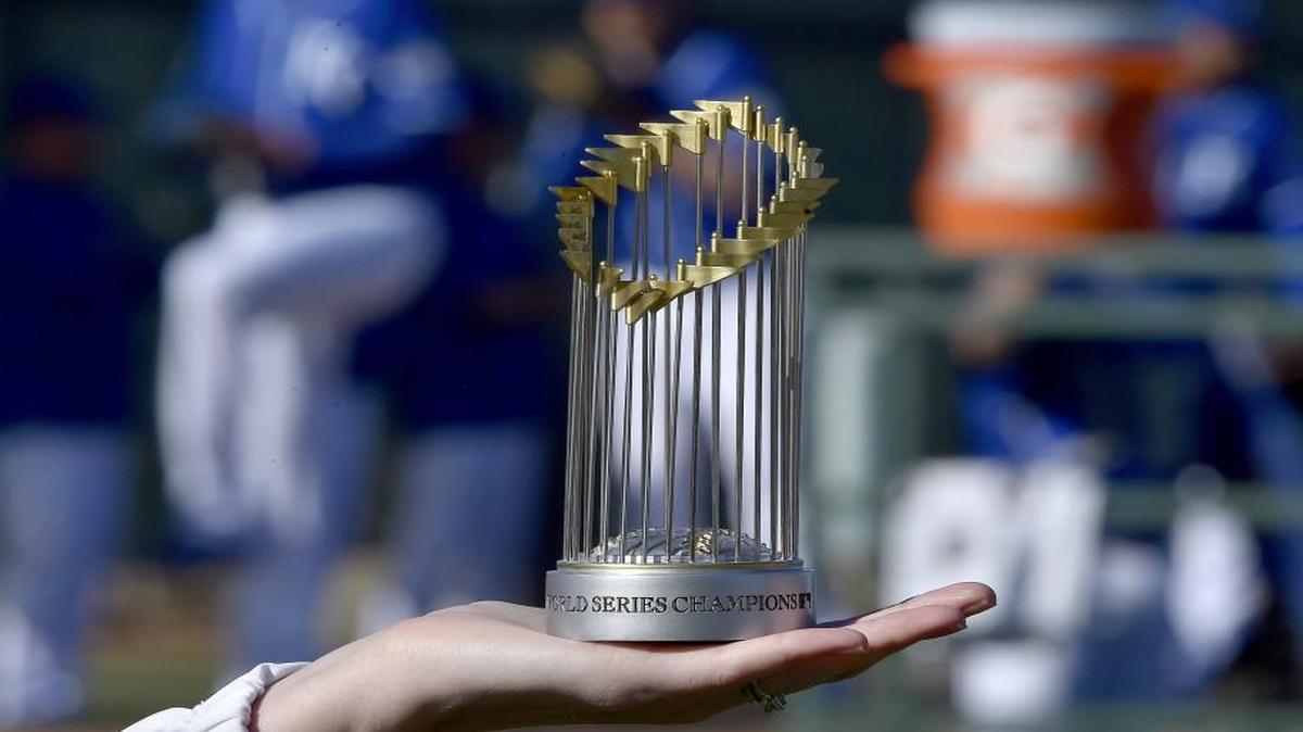 A miniature World Series Champions trophy made the rounds with a member of the Royals marketing staff during spring training in Surprise, Ariz.
