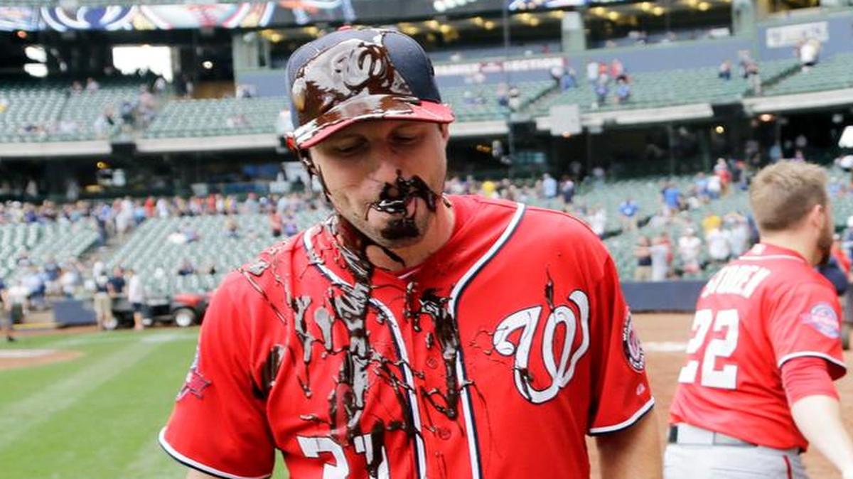 
Washington Nationals pitcher Max Scherzer was doused with chocolate syrup by teammate Drew Storen after throwing a complete game one-hitter as the Nationals beat the Milwaukee Brewers 4-0 on Sunday.
