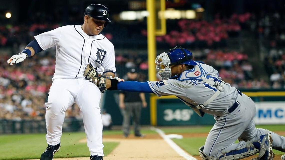 
The Tigers' Miguel Cabrera was tagged out by Royals catcher Salvador Perez (13) while trying to score on a hit by Victor Martinez during the first inning of Friday’s baseball game in Detroit.
