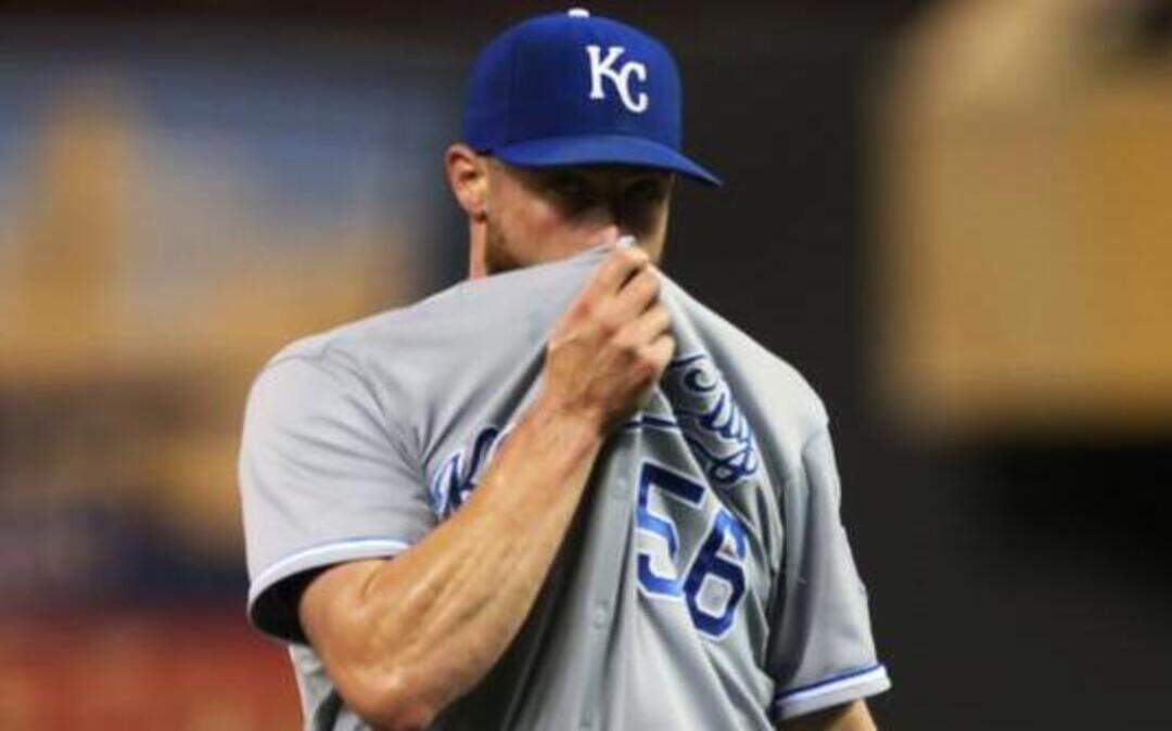 
Royals closer Greg Holland wiped his face after striking out the Minnesota Twins’ Danny Santana for the final out after giving up two runs in the ninth inning Friday night in Minneapolis. Holland got the save as the Royals won 6-5. 
