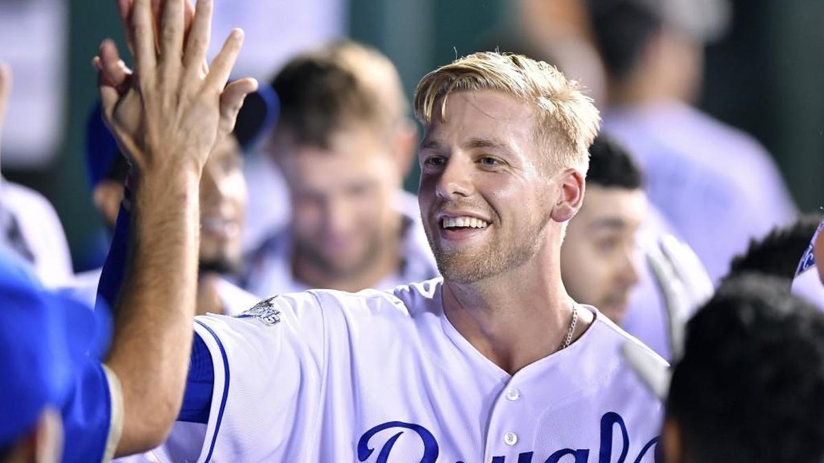The Royals’ Hunter Dozier was greeted in the dugout after scoring on a three-run home run by Christian Colon Thursday night at Kauffman Stadium. Dozier started in the outfield Friday night against the White Sox.