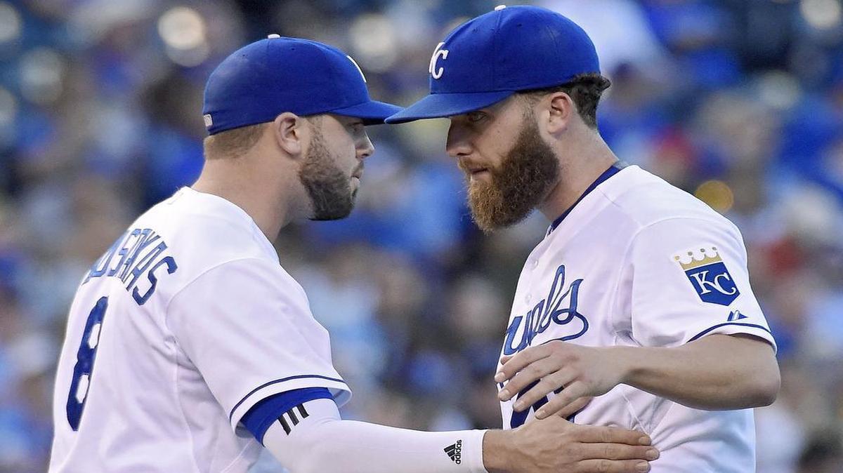 
Tuesday night against the Indians, Kansas City starter Danny Duffy faced 10 batters. Six collected hits. He plunked two more with pitches. Cleveland dented him for four runs and coasted for the next seven innings en route to a 9-3 win over the Royals. Third baseman Mike Moustakas (left) gave Duffy a pat before Duffy headed for the showers in the second inning.
