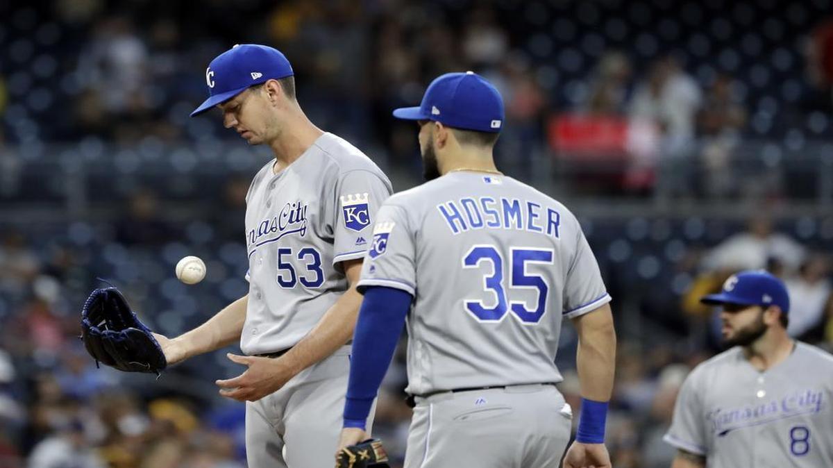Kansas City Royals starting pitcher Eric Skoglund (left) tossed the ball before leaving the game during the second inning against the San Diego Padres on Friday in San Diego.
