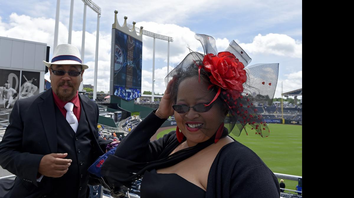 
Marvin and Christi Francois of Kansas City were wearing their finest as they took part in Dressed to the Nines Day before Sunday's baseball game between the Royals and Yankees at Kauffman Stadium. The game also featured players wearing uniforms to honor the Negro Leagues.
