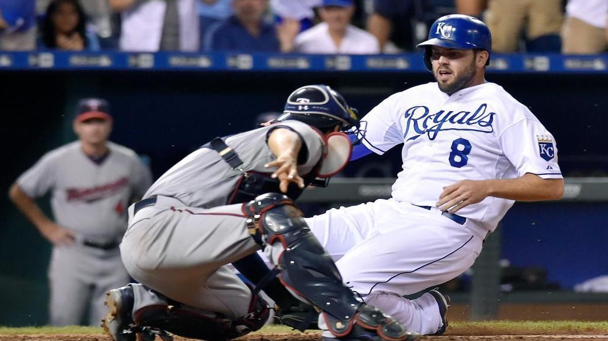 
The Royals' Mike Moustakas (8) was tagged out at the plate by Twins catcher Kurt Suzuki (8) to end the seventh inning of Monday's baseball game at Kauffman Stadium.
