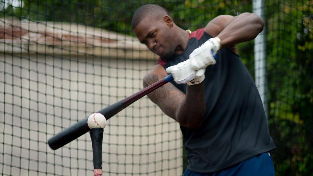 Kansas City Royals outfielder Jorge Soler takes batting practice at the house of his private coach in Miami.