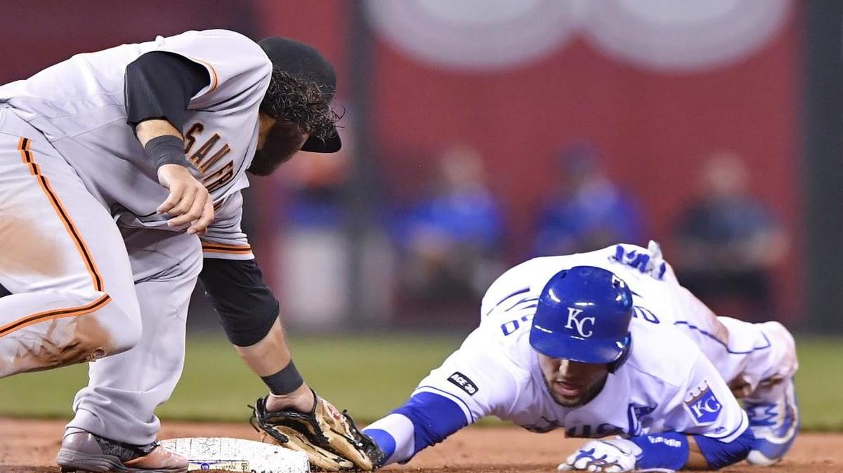 Kansas City Royals outfielder Paulo Orlando is tagged out by San Francisco Giants shortstop Brandon Crawford trying to steal second and sliding past the bag in the seventh inning Wednesday at Kauffman Stadium.
