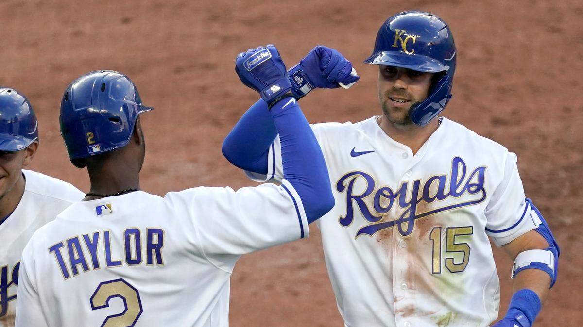 The Royals’ Whit Merrifield celebrates with Michael A. Taylor after hitting a three-run home run during the first inning against the Minnesota Twins on Friday, June 4, 2021, in Kansas City, Mo.