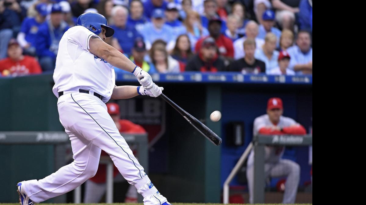 
Kansas City Royals designated hitter Kendrys Morales (25) connects on a three run home run in the first inning during Friday's baseball game against the St. Louis Cardinals on May 22, 2015 at Kauffman Stadium in Kansas City, Mo.
