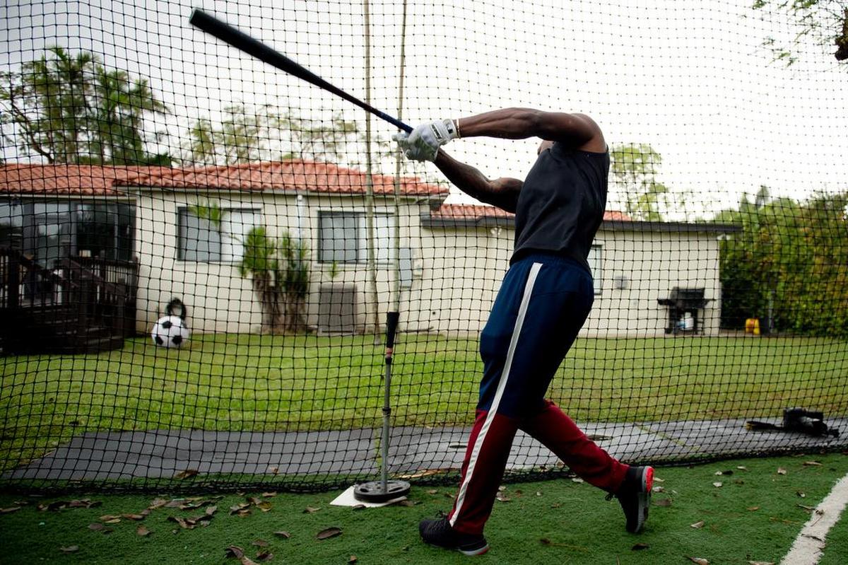 Kansas City Royals outfielder Jorge Soler takes batting practice at the house of his private coach in Miami.