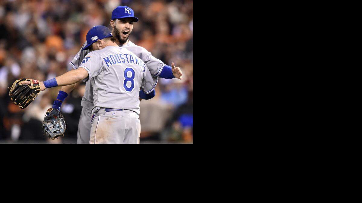 
Kansas City Royals first baseman Eric Hosmer (35) and Kansas City Royals third baseman Mike Moustakas (8) hug as they celebrate a 3-2 victory during Friday's Kansas City Royals and San Francisco Giants Game 3 of the World Series at AT&T Park on Oct. 22, 2014 in San Francisco, Calforinia.
