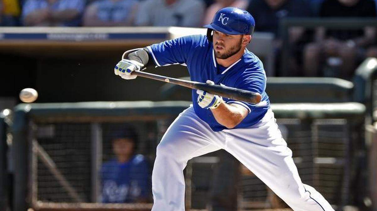 
Kansas City Royals third baseman Mike Moustakas dropped down a bunt in a spring-training game.
