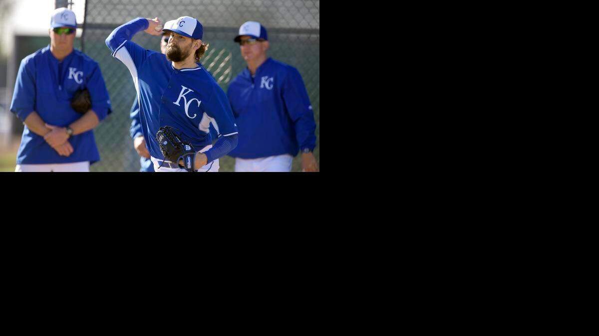 
Kansas City Royals pitcher Luke Hochevar warms up before throwing to hitters during Tuesday's spring training workout for the Royals on March 3, 2015 in Surprise, Ariz.
