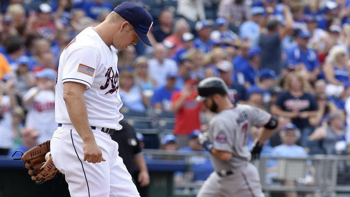 
Royals starting pitcher Joe Blanton (49) kicked at the dirt as the Minnesota Twins’ Joe Mauer (7) rounded the bases after hitting a two-run home run in the first inning Saturday night at Kauffman Stadium.
