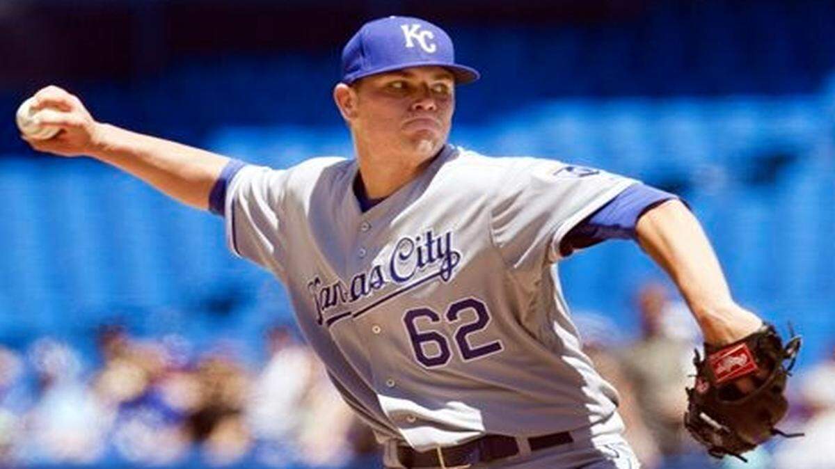 Royals starting pitcher Aaron Brooks throws against the Blue Jays during the first inning of Saturday’s game in Toronto