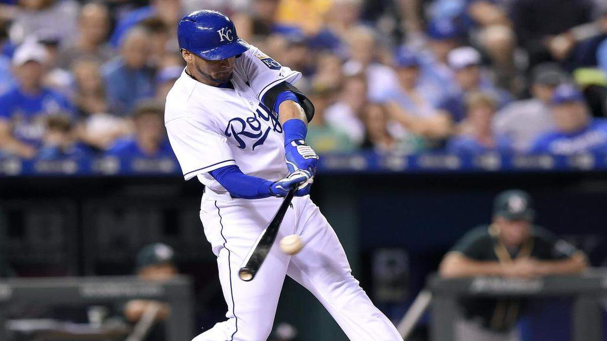 
Kansas City Royals' Paulo Orlando (16) connects on an RBI triple to score pinch runner Jarrod Dyson in the 8th inning of Friday's baseball game against the Athletics at Kauffman Stadium.

