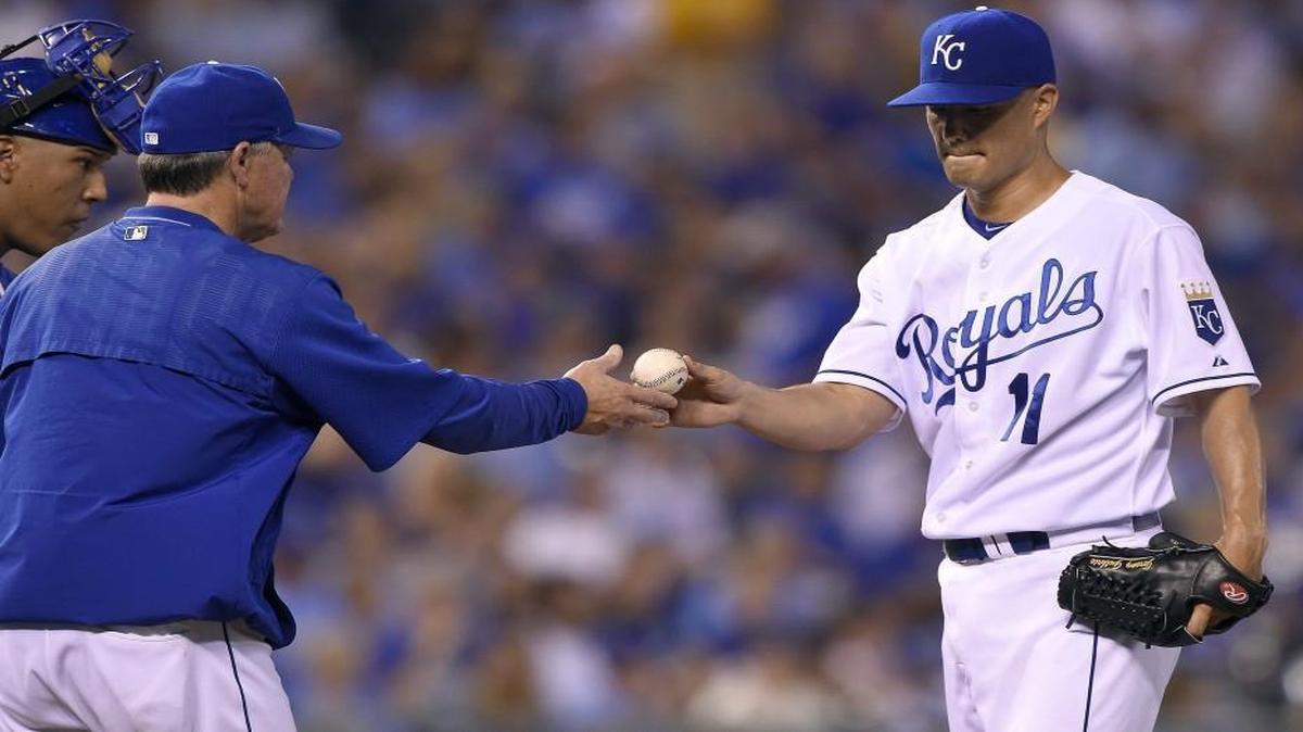 
Royals manager Ned Yost took the ball from starting pitcher Jeremy Guthrie (11) in the third inning against the Seattle Mariners on Tuesday night at Kauffman Stadium. Guthrie lasted only two-and-a-third innings, giving up nine earned runs on nine hits, including four home runs, as the Seattle Mariners beat the Royals 11-2.
