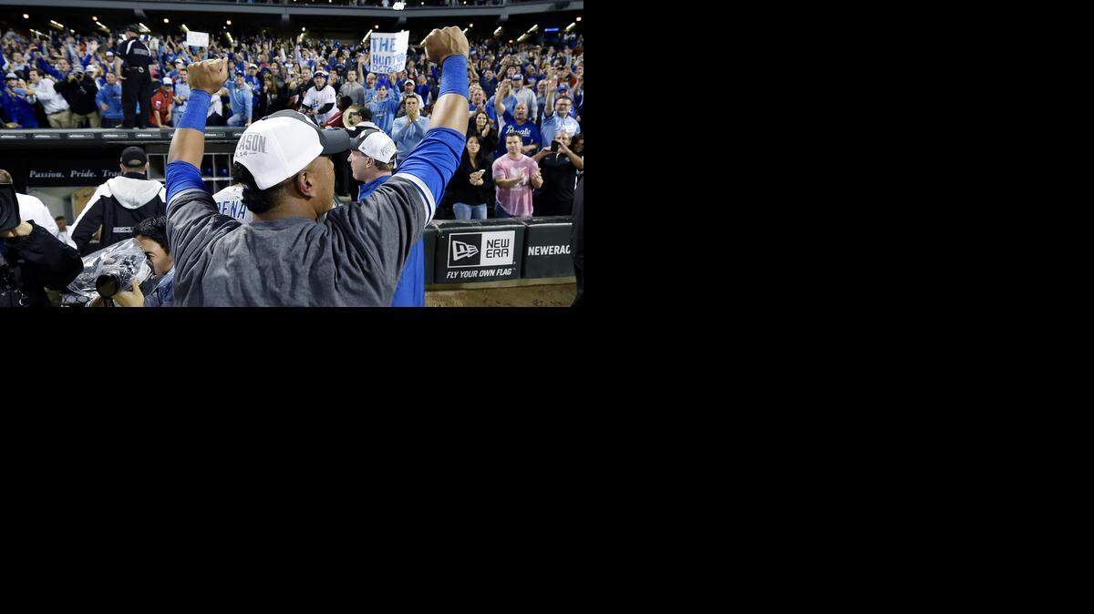 
Kansas City Royals fans cheer as Kansas City Royals' Salvador Perez acknowledges their cheers as they celebrate the teams clinching of a playoff spot after winning during Friday's baseball game against the Chicago White Sox on September 26, 2014 at U.S. Cellular Field in Chicago, Ill.
