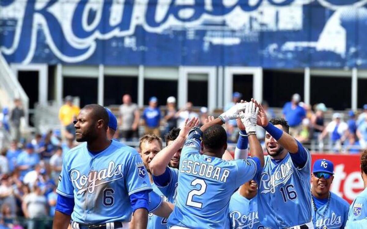 Kansas City Royals' Alcides Escobar was congratulated by Paulo Orlando after Escobar's game winning single in the ninth inning during Sunday's baseball game against the Los Angeles Angels at Kauffman Stadium in Kansas City, Mo.