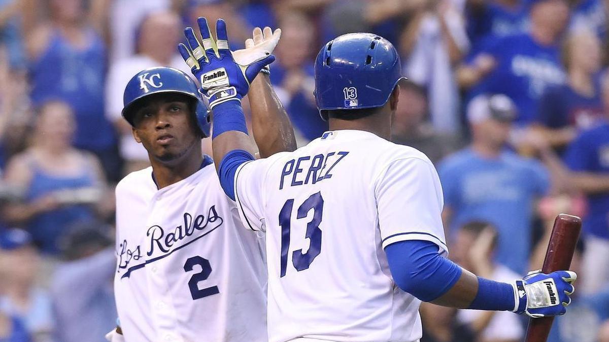 
Kansas City Royals' Alcides Escobar was greeted by Salvador Perez after scoring on a sacrifice fly by Escobar in the seventh inning of Saturday’s game.
