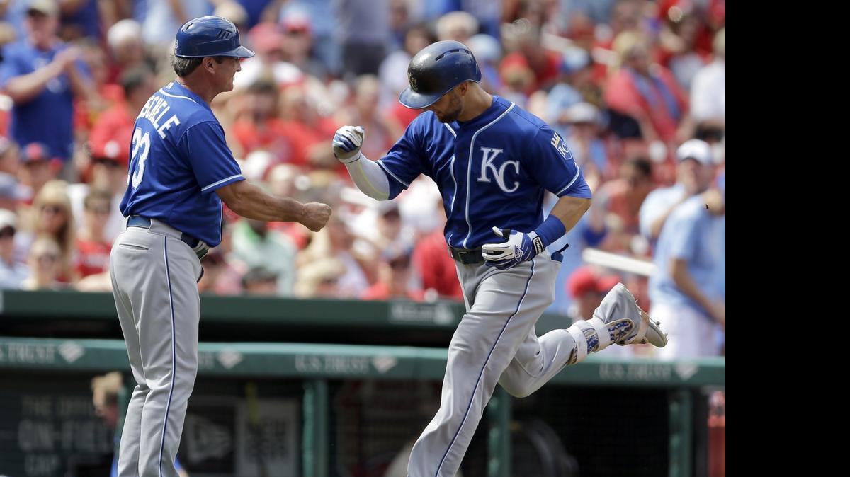 
Alex Gordon was congratulated by third-base coach Mike Jirschele after hitting a solo home run during the second inning on Saturday.
