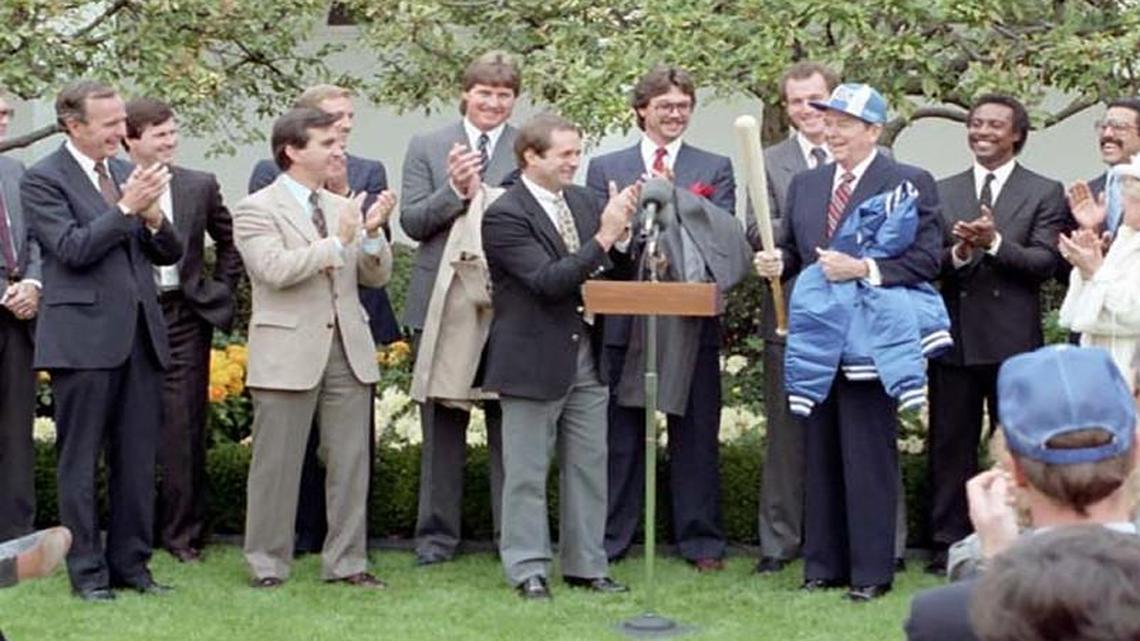 President Ronald Reagan received a Royals jacket, along with a hat and a bat from manager Dick Howser during a ceremony to congratulate the 1985 World Series Champion Kansas City Royals in the Rose Garden.