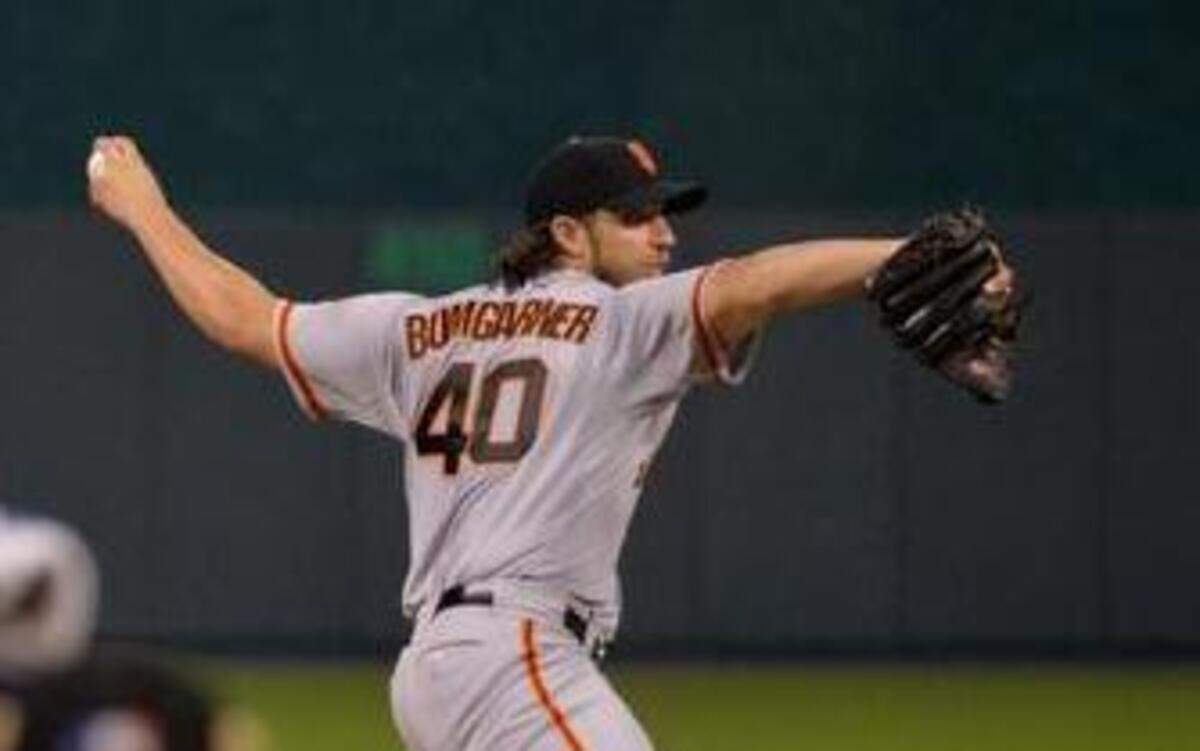 
San Francisco Giants starting pitcher Madison Bumgarner threw to Kansas City Royals second baseman Omar Infante in the fifth inning during game one of the World Series on Tuesday, October 21, 2014, at Kauffman Stadium in Kansas City, Mo.
