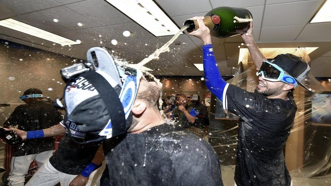 
Eric Hosmer dumped champagne into the mouth of Mike Moustakas after the Royals clinched the Central title.
