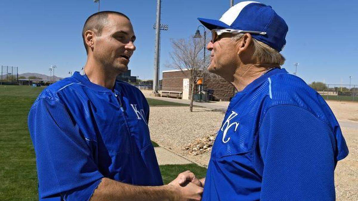 
The Royals’ newly signed pitcher Chris Young shakes hands with first base coach Rusty Kuntz during Saturday's spring training workout in Surprise, Ariz.
