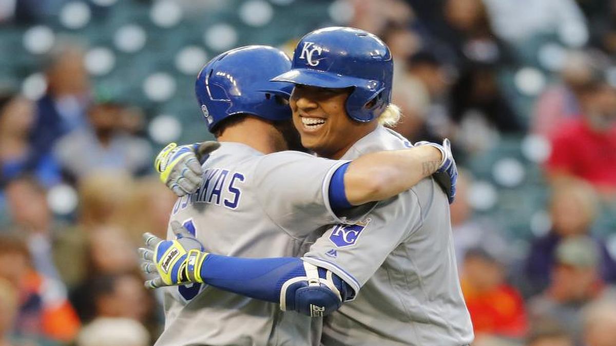 The Royals’ Salvador Perez (right) hugged teammate Mike Moustakas after Perez hit a home run in the second inning of Wednesday’s game against the Tigers in Detroit.
