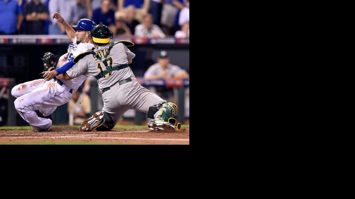 
In a botched attempt at a double steal in the first inning, Eric Hosmer of the Royals was tagged out a home by A’s catcher Geovany Soto.
