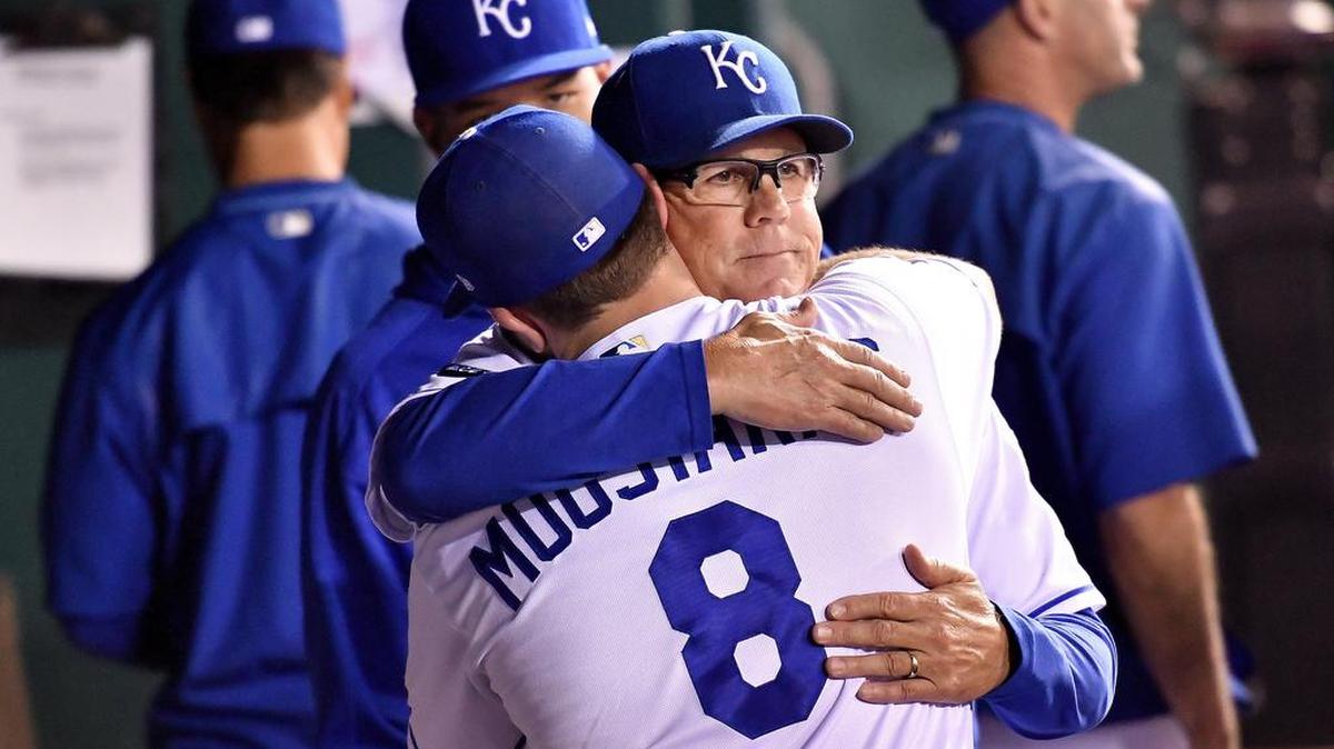 Kansas City Royals manager Ned Yost hugs Mike Moustakas after he left the game in the sixth inning against the Arizona Diamondbacks at Kauffman Stadium in Kansas City, Mo.
