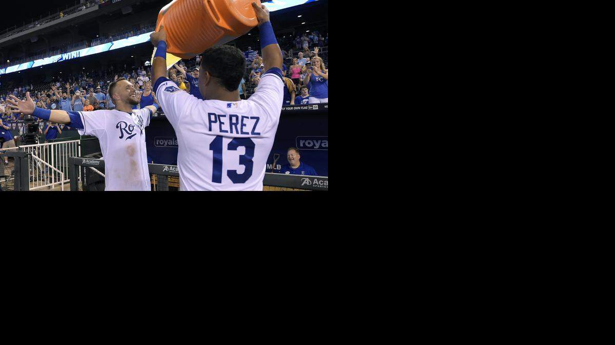 
Alex Gordon (4) got doused by teammate Salvador Perez after Gordon hit the a walk-off two-run home run to beat the Minnesota Twins Tuesday night at Kauffman Stadium.
